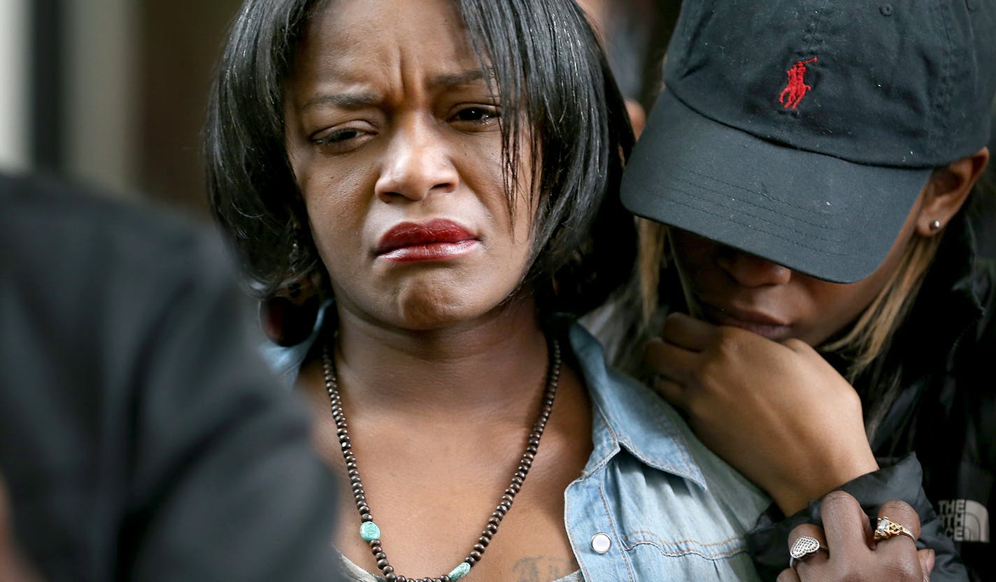 RayAnn Hayes, the woman who had been previously referred to as the girlfriend of Jamar Clark by Hennepin County Attorney Mike Freeman, is consoled by others during a press conference, Monday, April 4, 2016 at the Hennepin County Government Center in Minneapolis, MN. The Minneapolis NAACP held a press conference, including representatives of the Twin Cities Coalition for Justice for Jamar, Black Lives Matter Minneapolis, and Black Clergy United for Change to discuss recent developments in the Jam