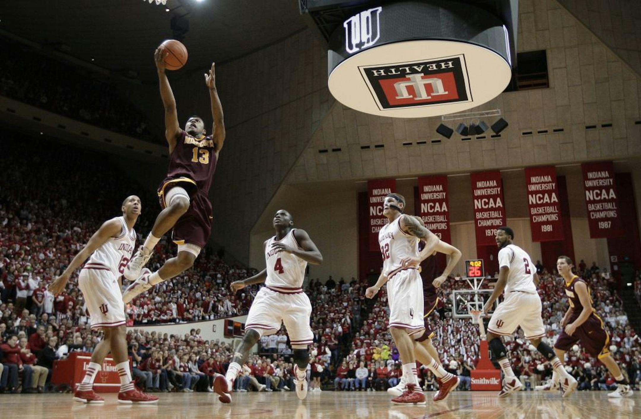 Minnesota's Maverick Ahanmisi (13) puts up a shot during the first half of an NCAA college basketball game against Indiana on Thursday, Jan. 12, 2012, in Bloomington, Ind.