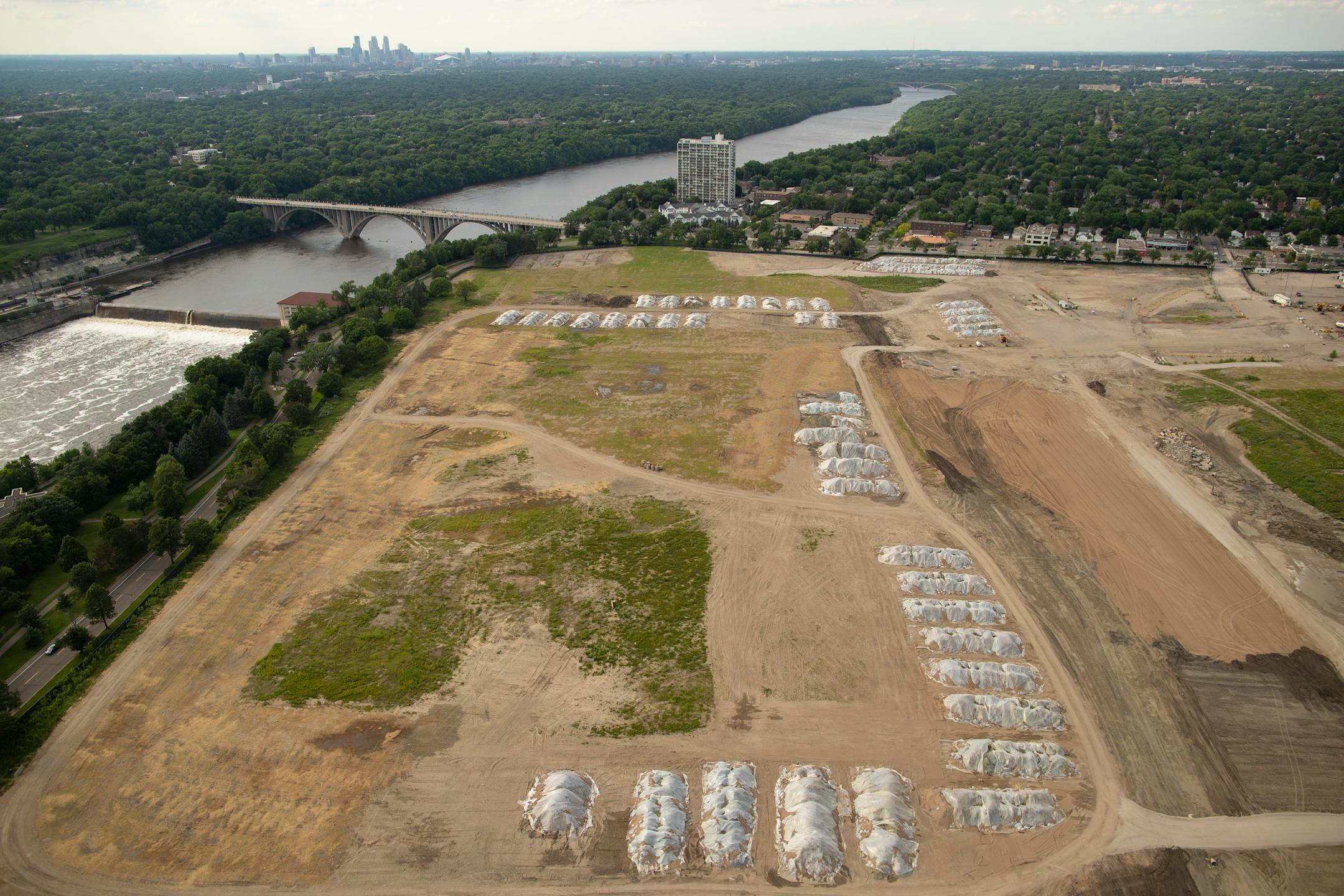 The former Ford assembly plant site, looking northwest, with the downtown Minneapolis in the background.