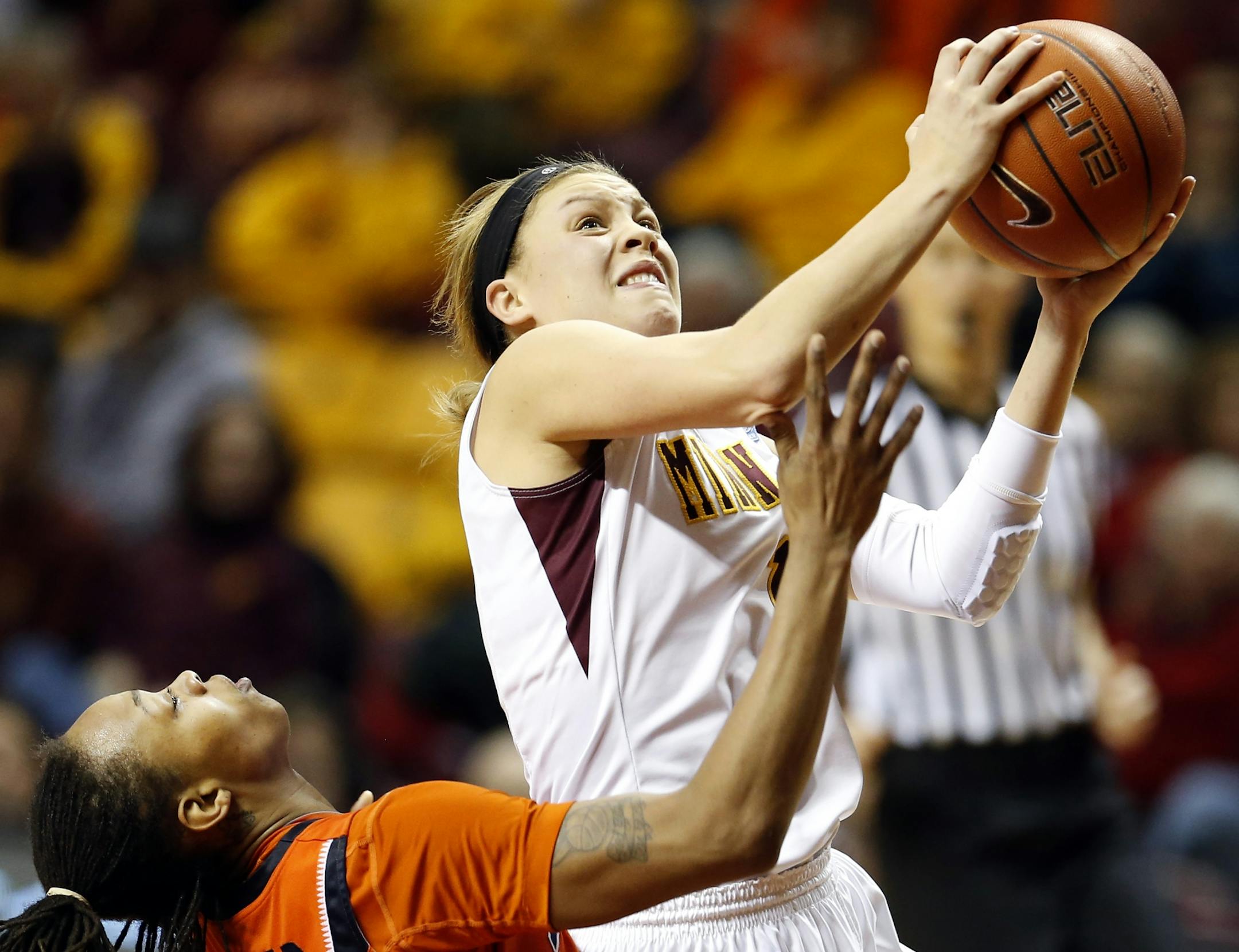 Gophers guard Rachel Banham (1) made a shot as she was fouled by Adrienne GodBold (24) in the second half. Banham finished the game with 37 points.