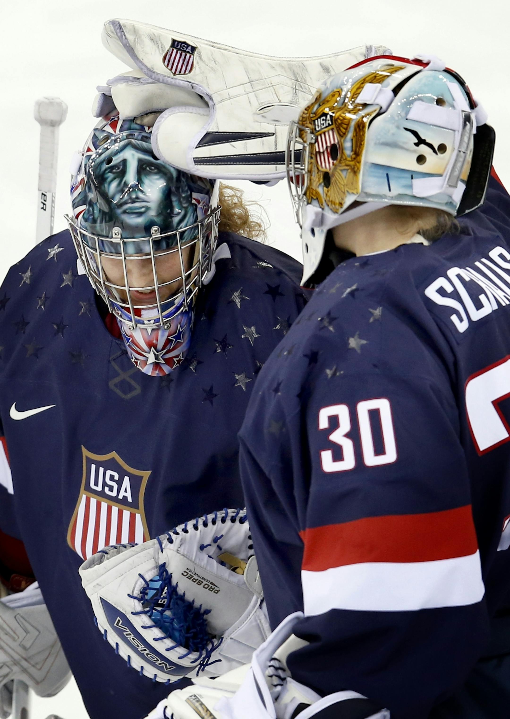 USA goalie Jessie Vetter (31) was greeted by Molly Schaus (30) at the end of the second period. USA beat Sweden by a final score of 6-1.