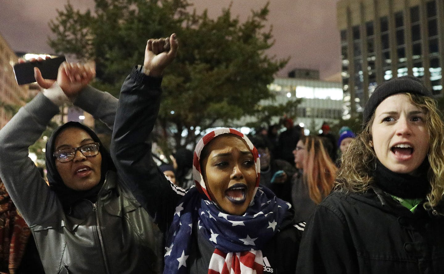 Hannan Bilal, center, protested with her friends against President Trump's temporary immigration ban on seven predominantly Muslim countries Tuesday. ] ANTHONY SOUFFLE &#x2022; anthony.souffle@startribune.com Protesters rallied against President Donald Trump's temporary immigration ban on seven predominantly Muslim countries Tuesday, Jan. 31, 2017 at the Warren E. Burger Federal Building & United States Courthouse in Minneapolis.