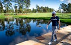 Dustin Johnson walks to the 15th green during round two at the Masters