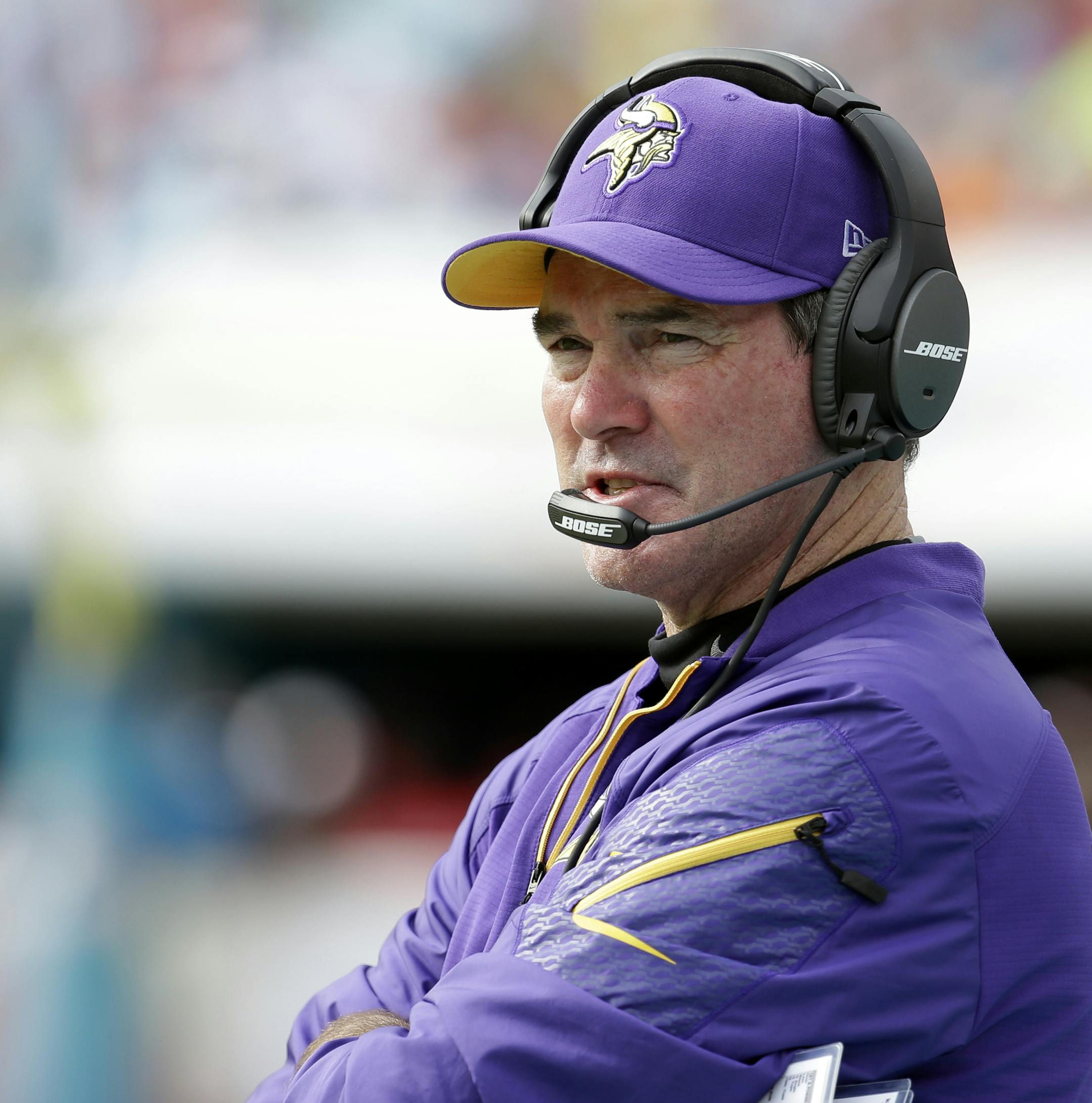 Minnesota Vikings head coach Mike Zimmer talks on the sidelines during the first half of an NFL football game against the Miami Dolphins, Sunday, Dec. 21, 2014, in Miami Gardens, Fla. (AP Photo/Lynne Sladky)