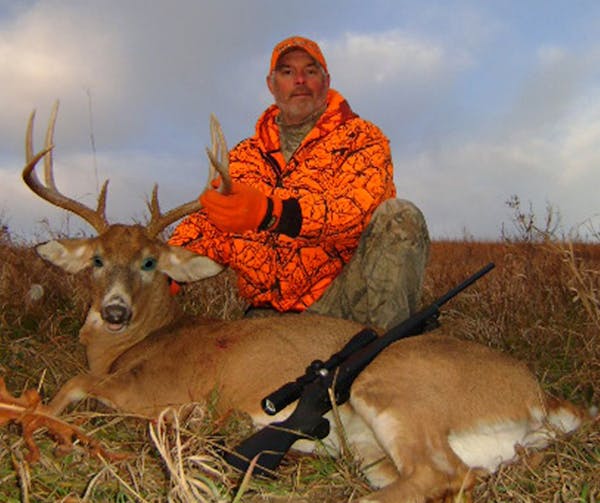 Don Sauter of Arlington, Minn., with a deer he bagged in Nebraska in 2011.