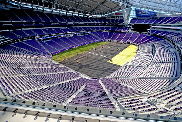 Workers from the Minnesota Sodding Company (MSC) placed Bue Grass onto the US Bank Stadium field in preparation for Wednesday's international soccer g