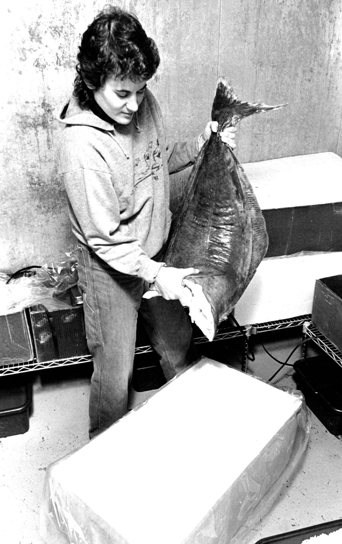 September 30, 1982 Suzanne Weinstein, who used to work with computers, hoisted a halibut at her small Minneapolis distributorship, Coastal Seafoods. September 29, 1982 Donald Black, Minneapolis Star Tribune