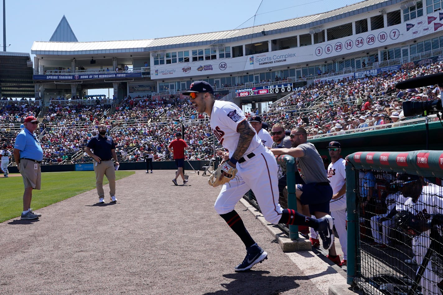 Minnesota Twins shortstop Carlos Correa (4) runs out to the field during a spring training baseball game against the Boston Red Sox at Hammond Stadium Sunday, March 27, 2022, in Fort Myers, Fla. (AP Photo/Steve Helber)