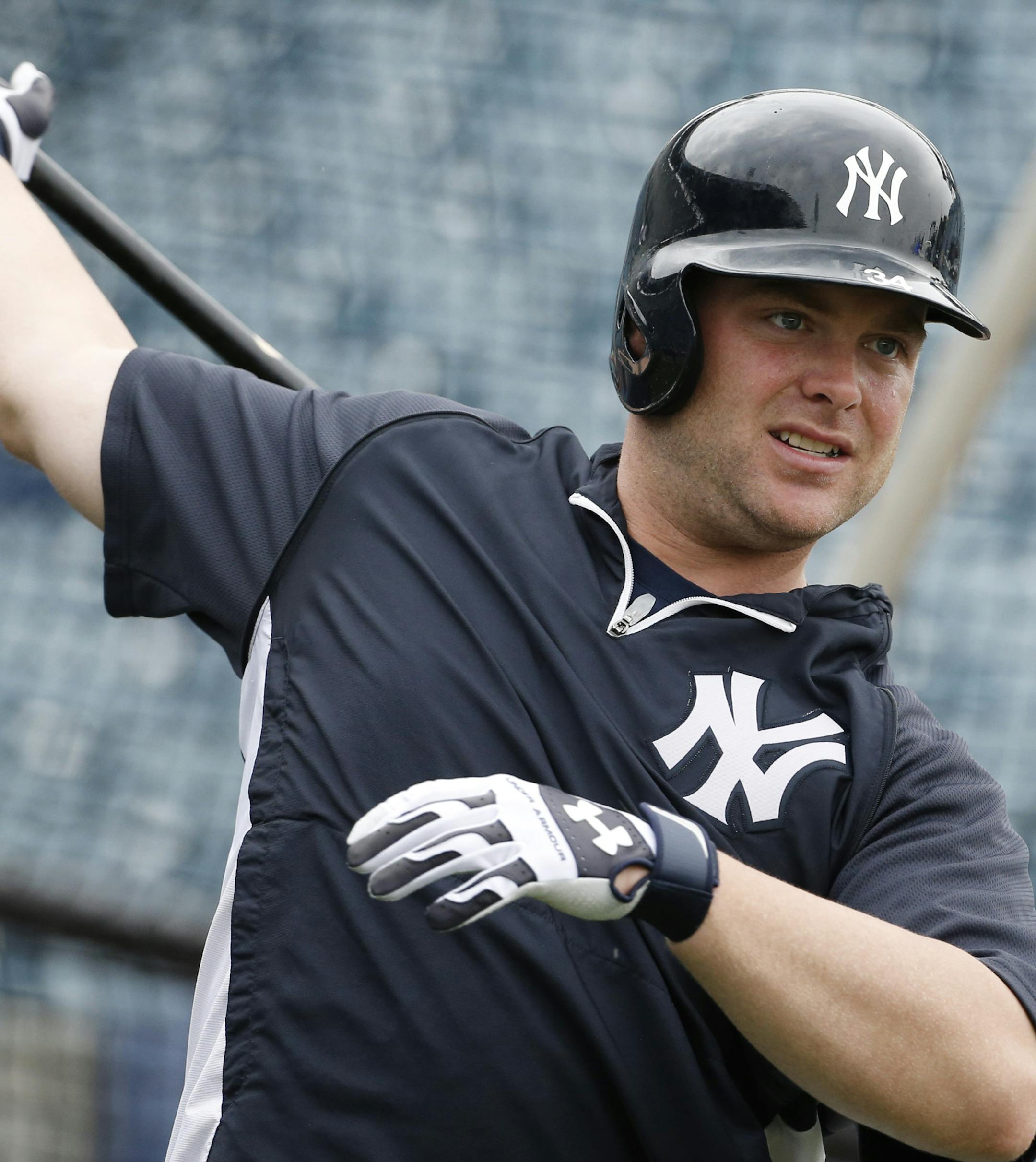 New York Yankees Brian McCann swings his bat before taking batting practice prior to a spring exhibition baseball game against the Miami Marlins in Tampa, Fla., Friday, March 28, 2014. (AP Photo/Kathy Willens)