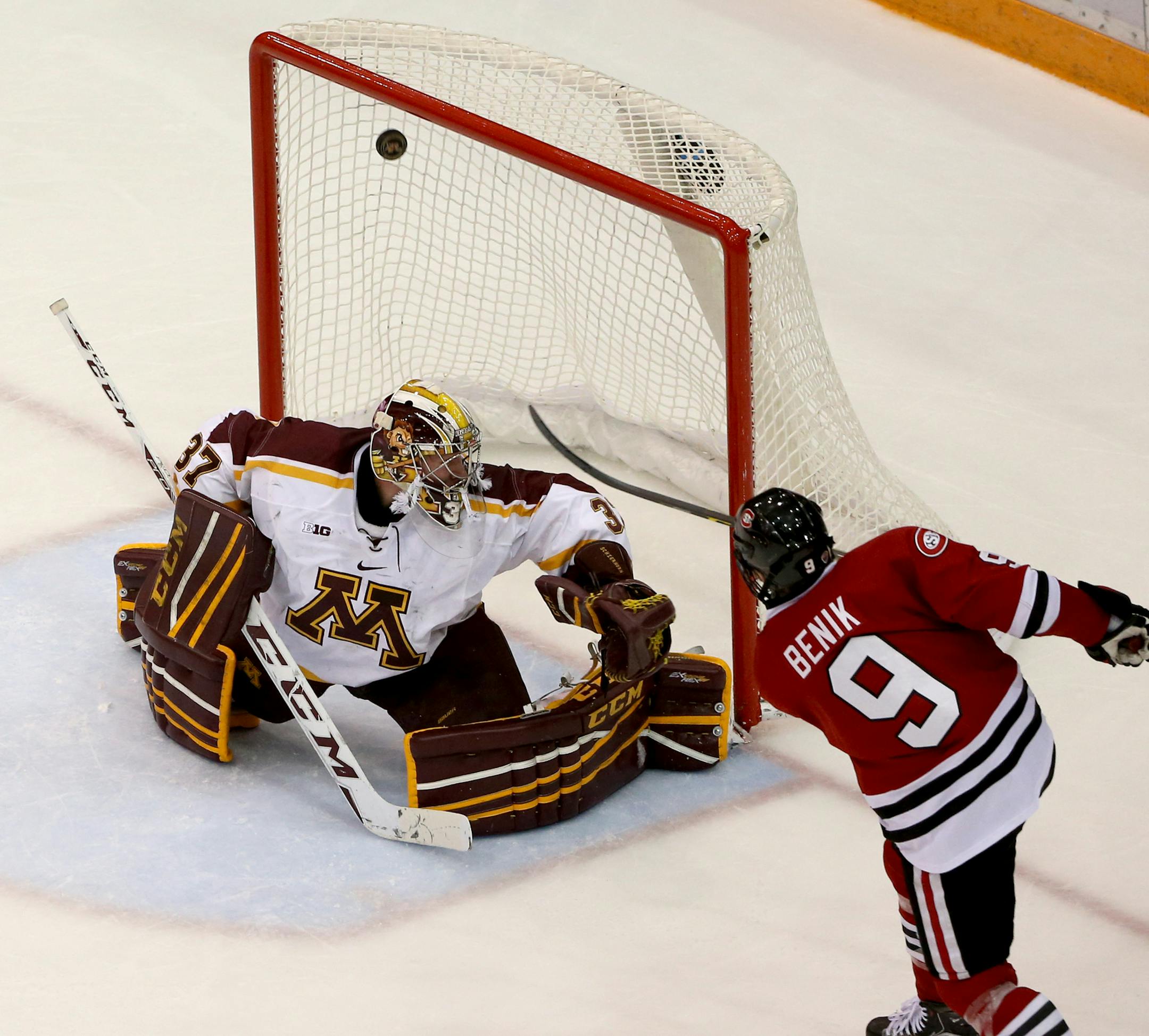 St. Cloud State's Joey Benik scored a goal on Gopher Eric Schierhorn to take the lead during the third period. ] (KYNDELL HARKNESS/STAR TRIBUNE) kyndell.harkness@startribune.com Gophers vs St Cloud State at Mariucci Area in Minneapolis Min., Friday November 27, 2015.