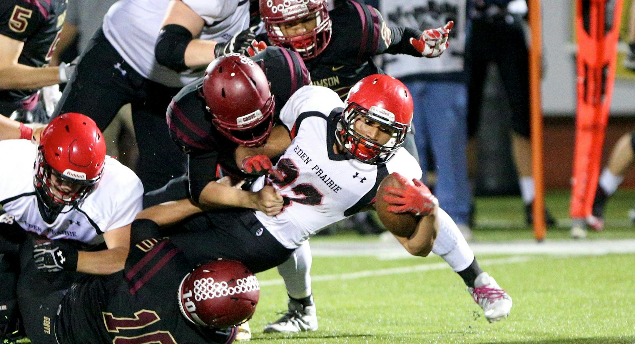 Eden Prairie junior running back Solo Falaniko stretches for extra yardage in the Eagles' 28-15 victory over Maple Grove on Friday.
