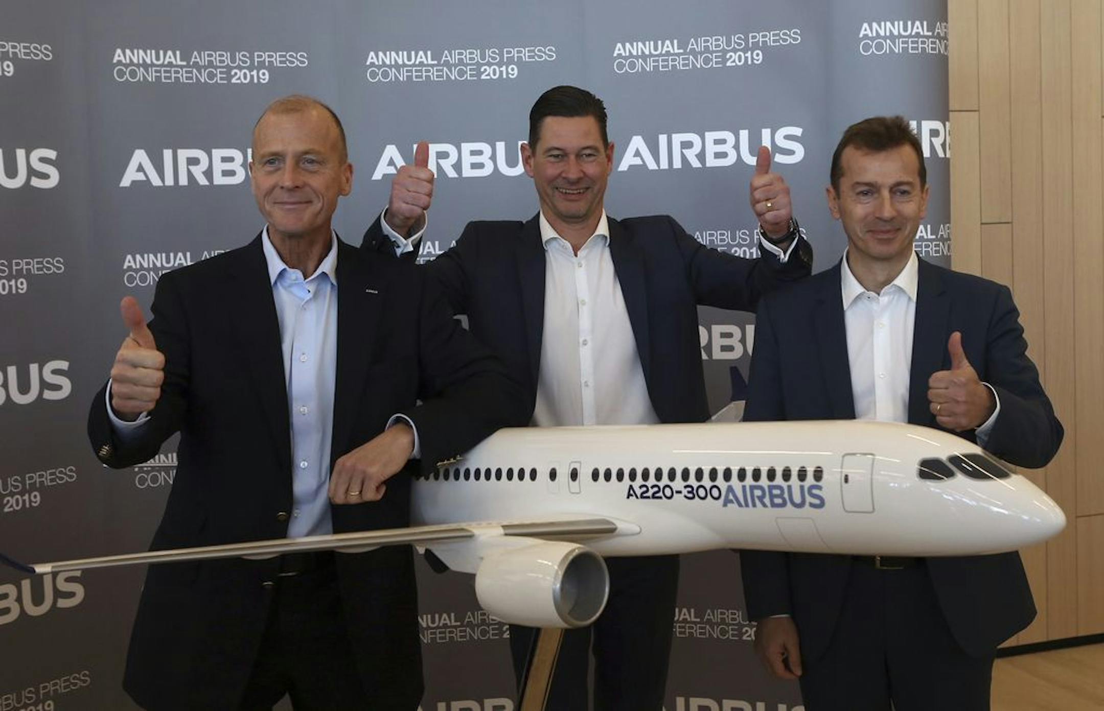 Airbus CEO Tom Enders, left, CFO Harald Wilhelm and president of Airbus Commercial Aricraft Guillaume Faury, thumb up before the presentation of Airbus 2018 results in Toulouse, southern France, Thursday, Feb.14, 2019. The European plane manufacturer Airbus said Thursday it will stop making its superjumbo A380 in 2021 for lack of customers, abandoning the world's biggest passenger jet and one of the aviation industry's most ambitious and most troubled endeavors.