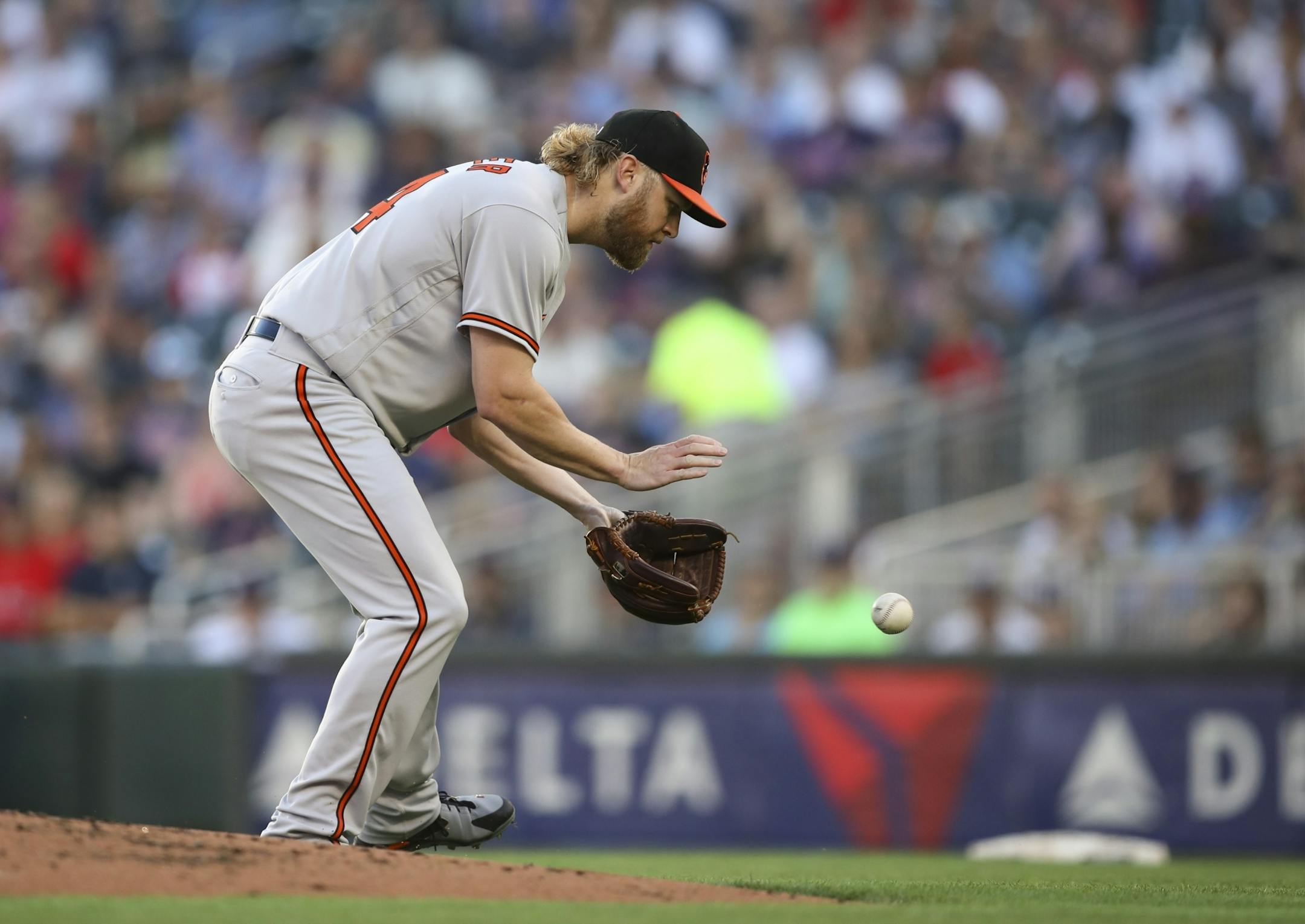 Baltimore Orioles starting pitcher Andrew Cashner fielded a grounder hit to him by the Twins' Eddie Rosario in the first inning.
