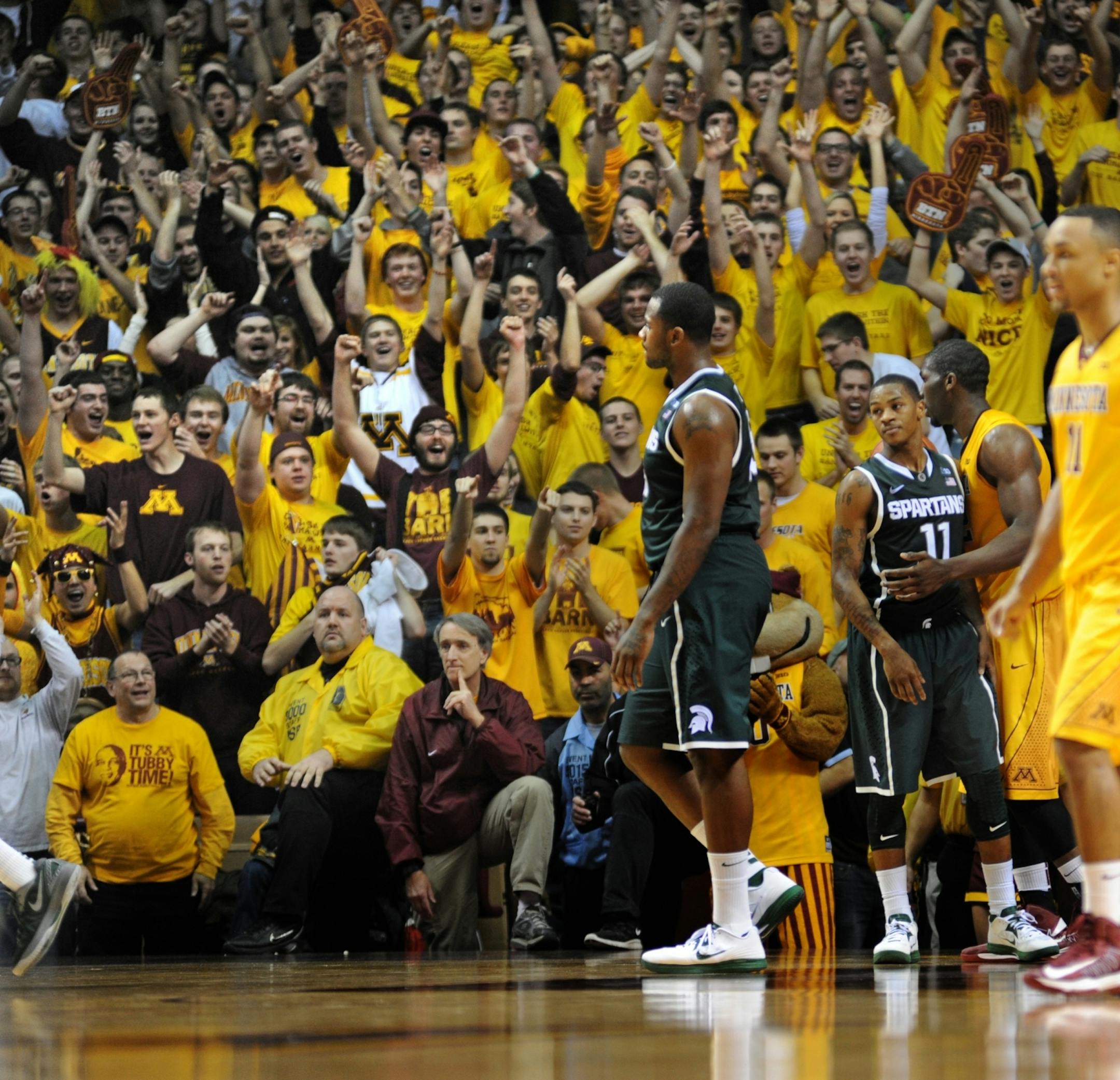 Gopher fans celebrate beating Michigan State on Dec. 31, 2012.