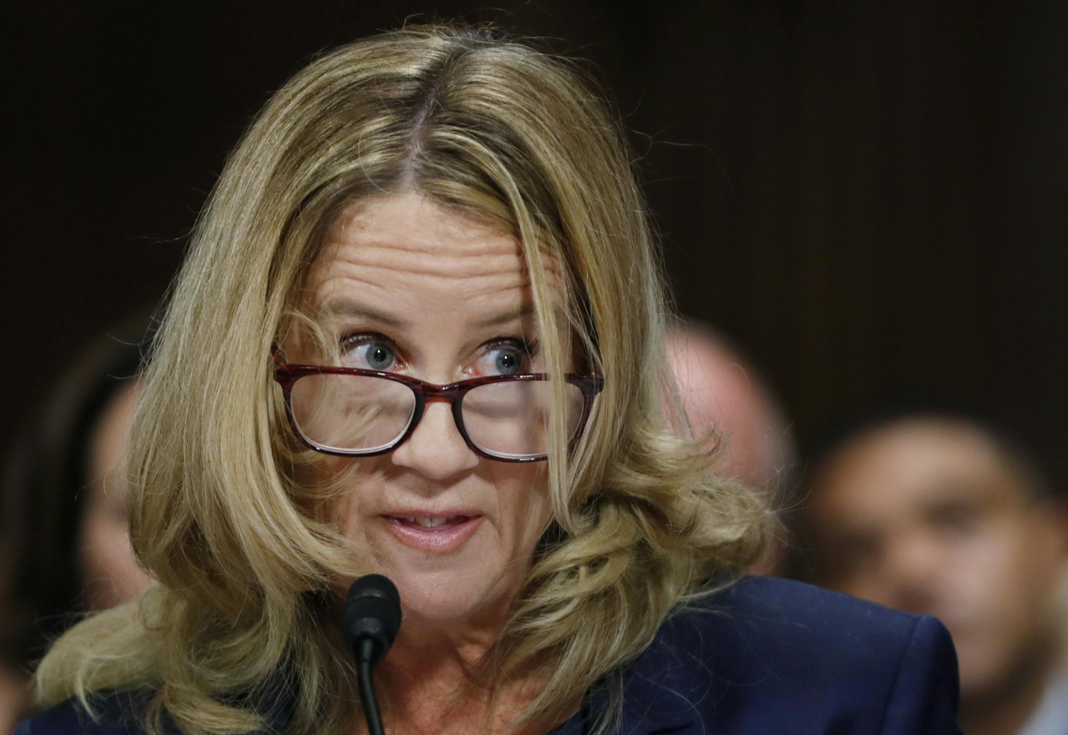 Christine Blasey Ford listens while testifying before a Senate Judiciary Committee hearing, Thursday, Sept. 27, 2018 on Capitol Hill in Washington.