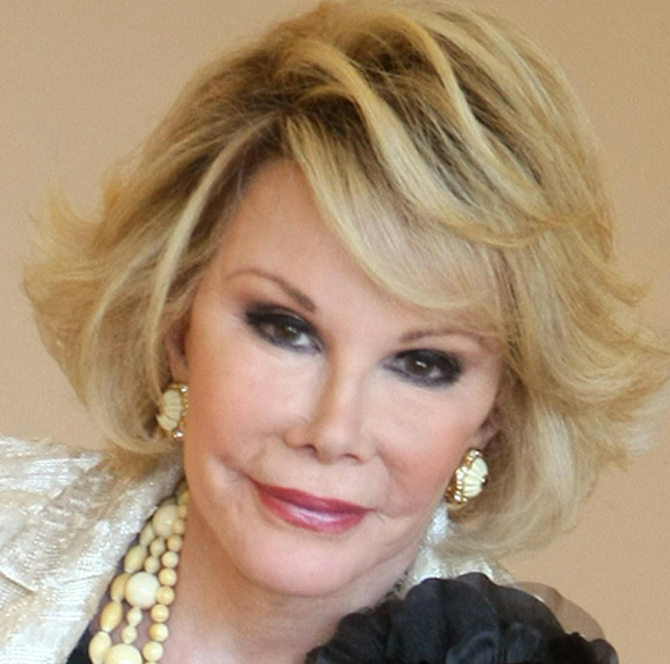 FILE - This Oct. 5, 2009 file photo shows Joan Rivers posing as she presents "Comedy Roast with Joan Rivers " during the 25th MIPCOM (International Film and Programme Market for TV, Video, Cable and Satellite) in Cannes, southeastern France. In October 1986, Rivers made TV history as the first woman hosting a late-night broadcast talk show. She was the first face of the Fox network, headlining its first program, "The Late Show Starring Joan Rivers." (AP Photo/Lionel Cironneau, File)