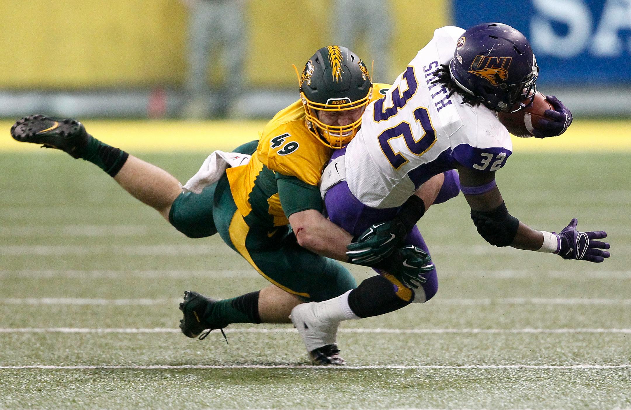 North Dakota State's Nick DeLuca, left, tackles Northern Iowa's Tyvis Smith earlier this season.
