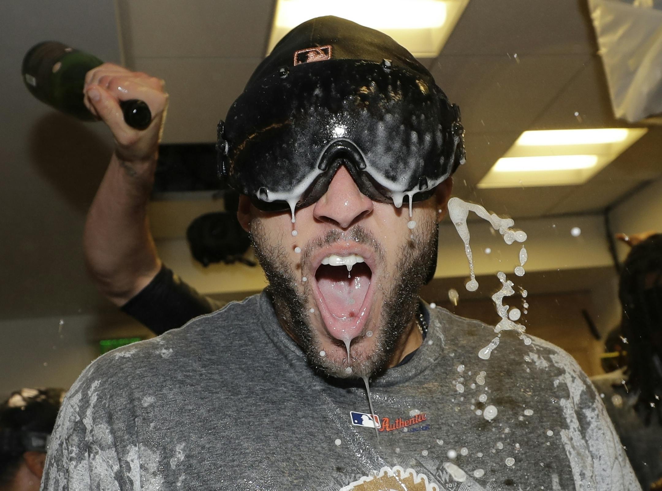 Houston Astros' George Springer celebrates after Game 7 of baseball's World Series against the Los Angeles Dodgers Wednesday, Nov. 1, 2017, in Los Angeles. The Astros won 5-1 to win the series 4-3. (AP Photo/David J. Phillip)