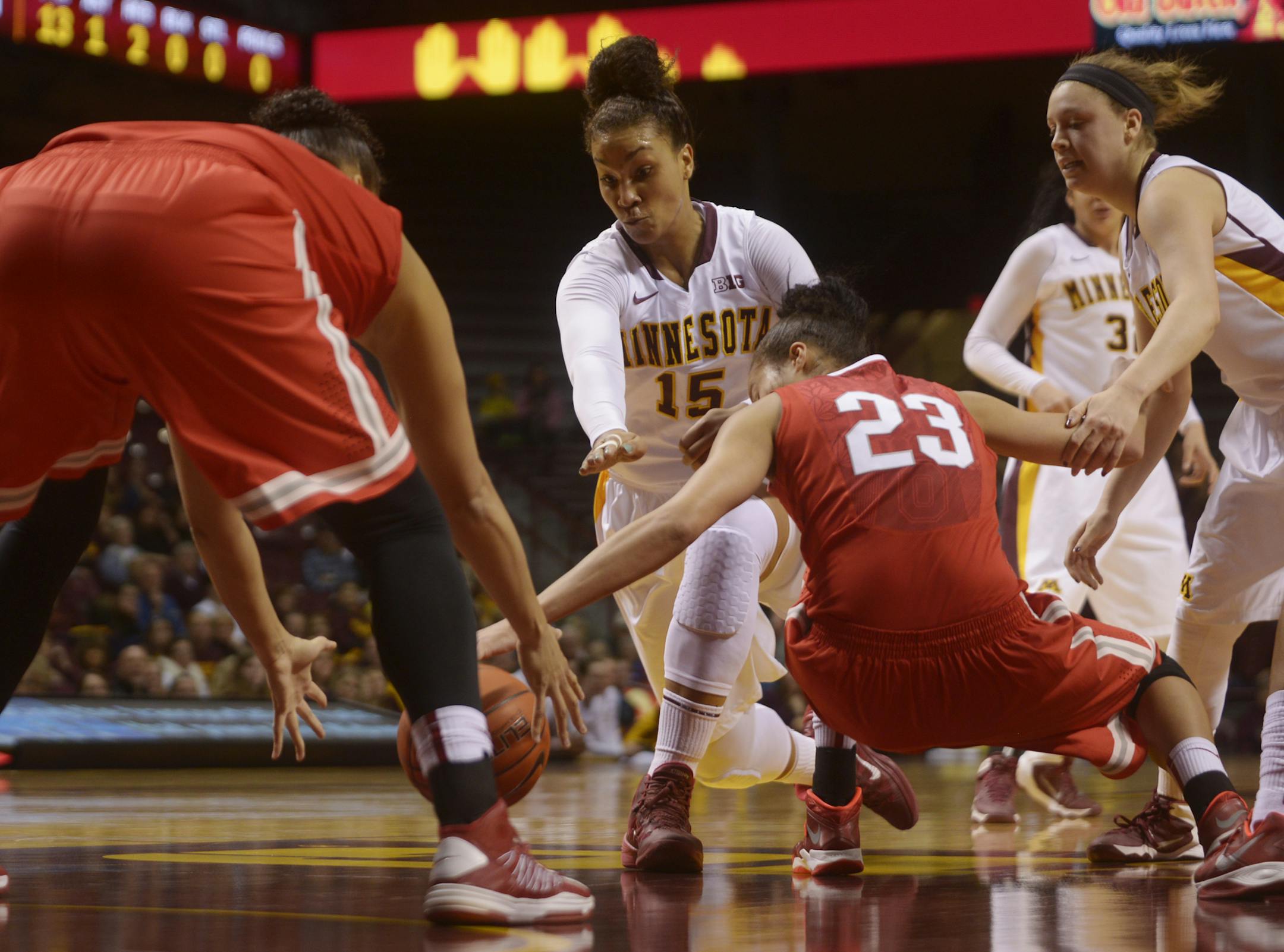 Gophers' Micaella Riche scrambles for a loose ball during the first half of the Women's Gopher basketball against Ohio State on Sunday, March 2, 2014 at WIlliams Arena in Minneapolis, Minn.