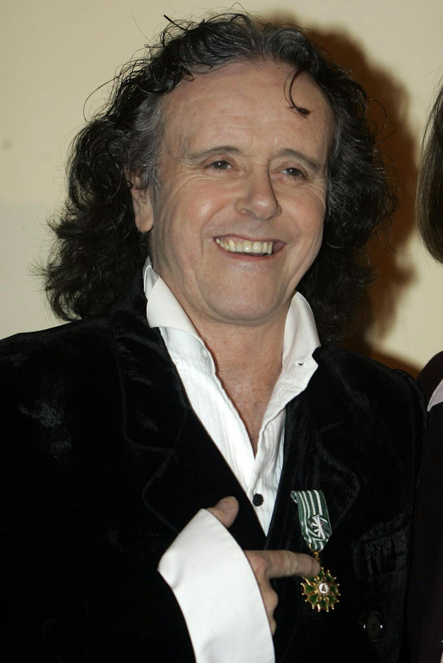 Scottish singer-songwriter and guitarist Donovan shows his medal after received The Award of "Officier des Arts et Lettres" from the French Minister of Culture and Communication, Christine Albanel during the 43rd MIDEM (International record music publishing and video music market) in Cannes, southern France, Sunday Jan. 18, 2009. (AP Photo/Lionel Cironneau)