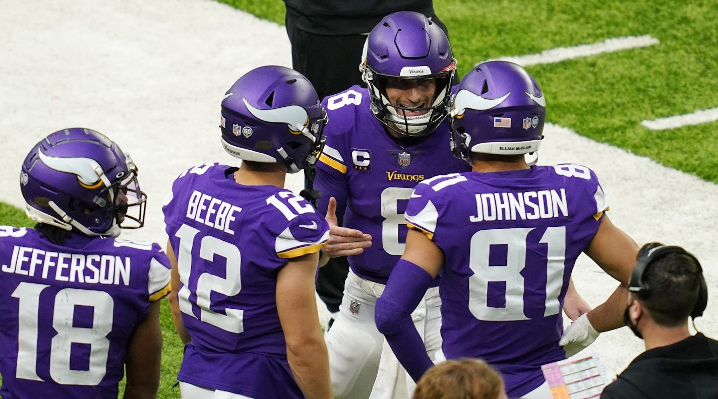 Minnesota Vikings quarterback Kirk Cousins (8) had a lively exchange with Minnesota Vikings wide receiver Bisi Johnson (81) on the sidelines in the third quarter. ] ANTHONY SOUFFLE • anthony.souffle@startribune.com