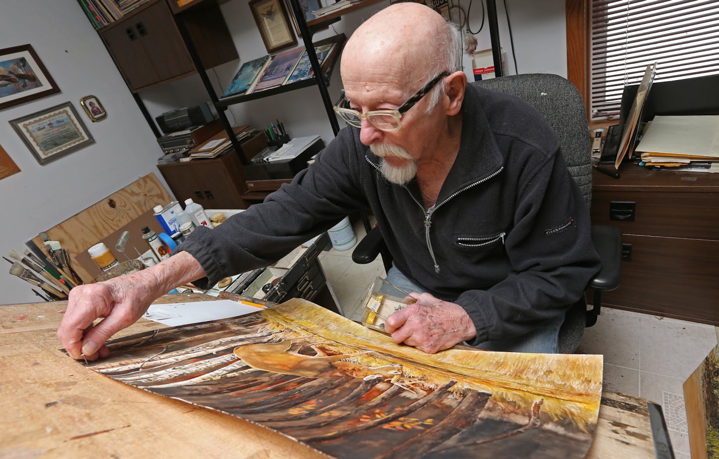 Octogenarian wildlife artist Louis Raymer worked on a watercolor painting at his Minneapolis studio on 2/28/14.] Bruce Bisping/Star Tribune bbisping@startribune.com Louis Raymer/source.