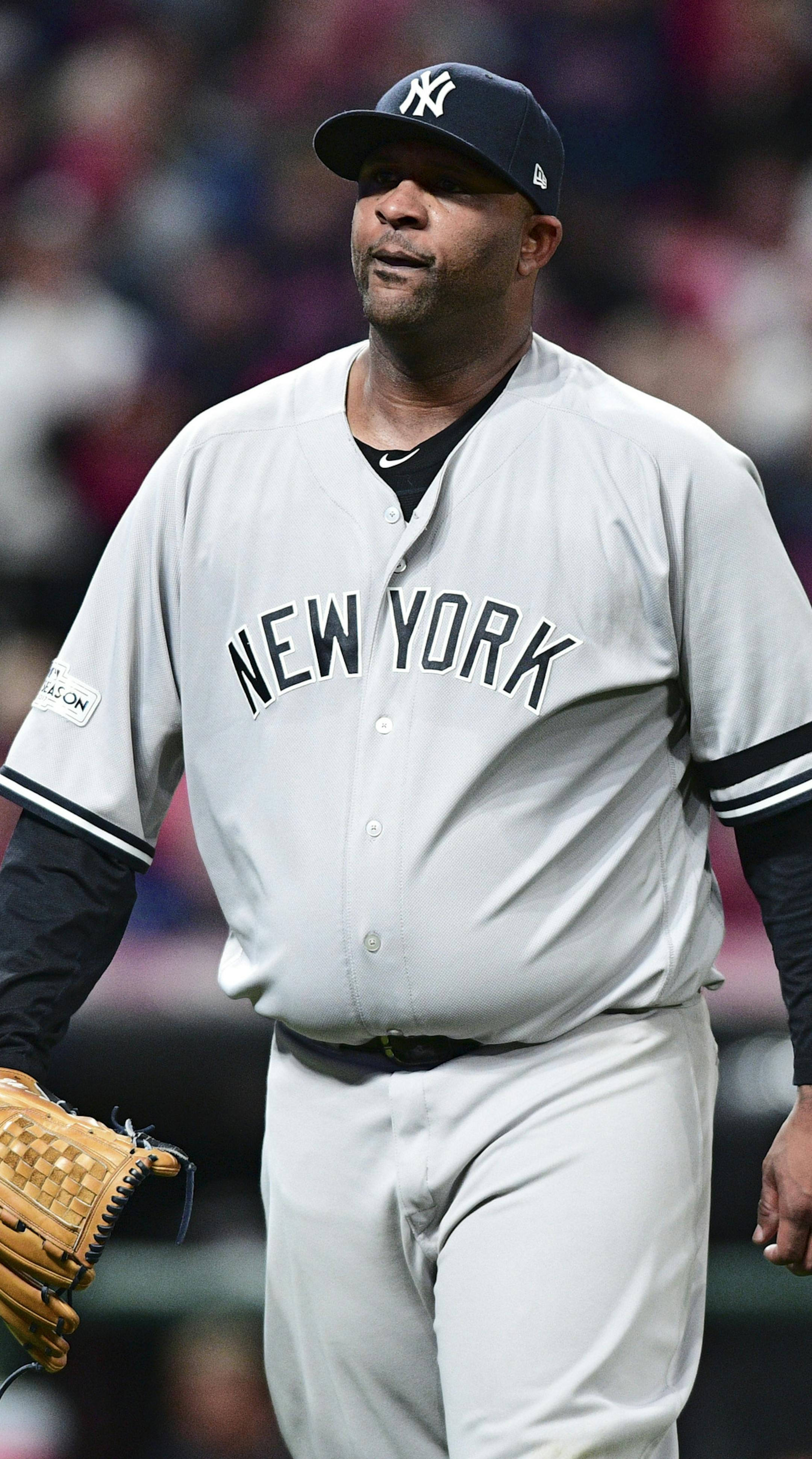 New York Yankees starting pitcher CC Sabathia walks back to the dugout in the fourth inning of Game 5 of baseball's American League Division Series against the Cleveland Indians, Wednesday, Oct. 11, 2017, in Cleveland. (AP Photo/David Dermer)