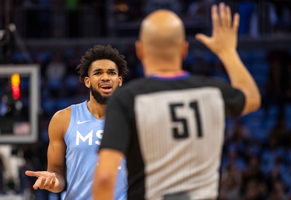 Karl-Anthony Towns complains about a foul called on him in the first half of a 124-117 loss against the Clippers on Dec. 13