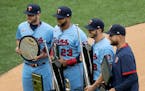 Minnesota Twins Josh Donaldson, Nelson Cruz, Mitch Graver and Rocco Baldelli posed for a photo with their awards before the start of a game.