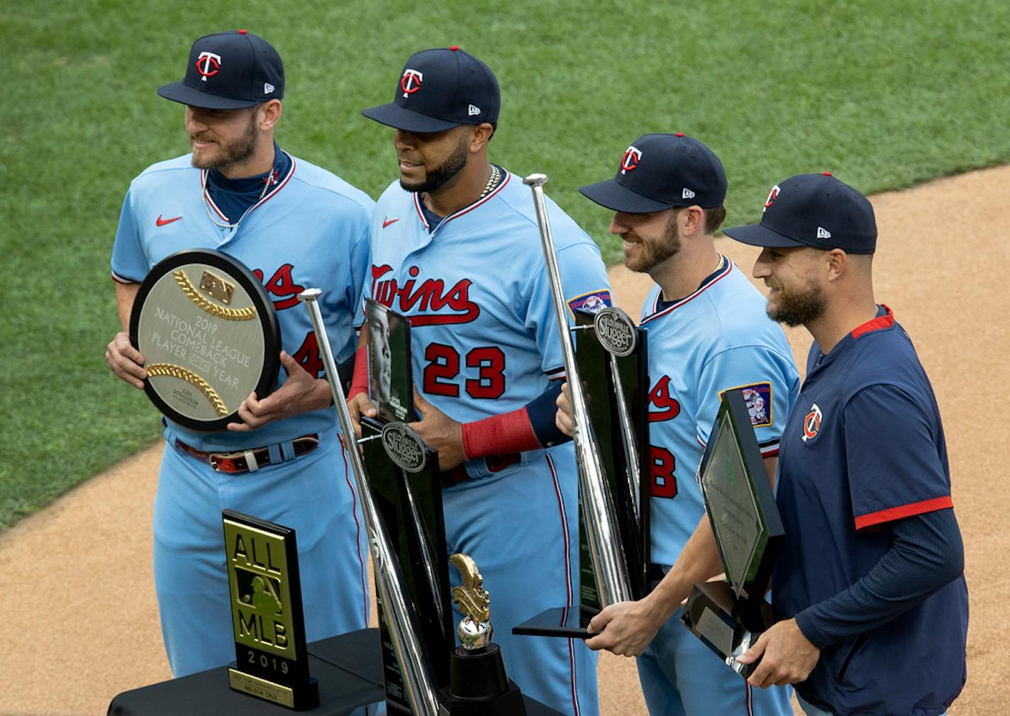 Minnesota Twins Josh Donaldson, Nelson Cruz, Mitch Graver and Rocco Baldelli posed for a photo with their awards before the start of a game.