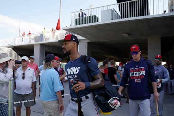 Minnesota Twins center fielder Byron Buxton (25) walked with his teammates out to the practice field Tuesday.