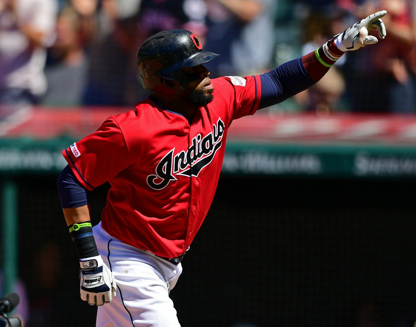 Cleveland Indians' Carlos Santana celebrates after hitting a solo home run off Minnesota Twins relief pitcher Trevor May in the seventh inning of a baseball game, Sunday, July 14, 2019, in Cleveland. The Indians won 4-3. (AP Photo/David Dermer)