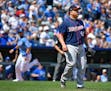 Minnesota Twins starting pitcher Bartolo Colon watches an RBI double by Kansas City Royals designated hitter Brandon Moss as Eric Hosmer scores in the