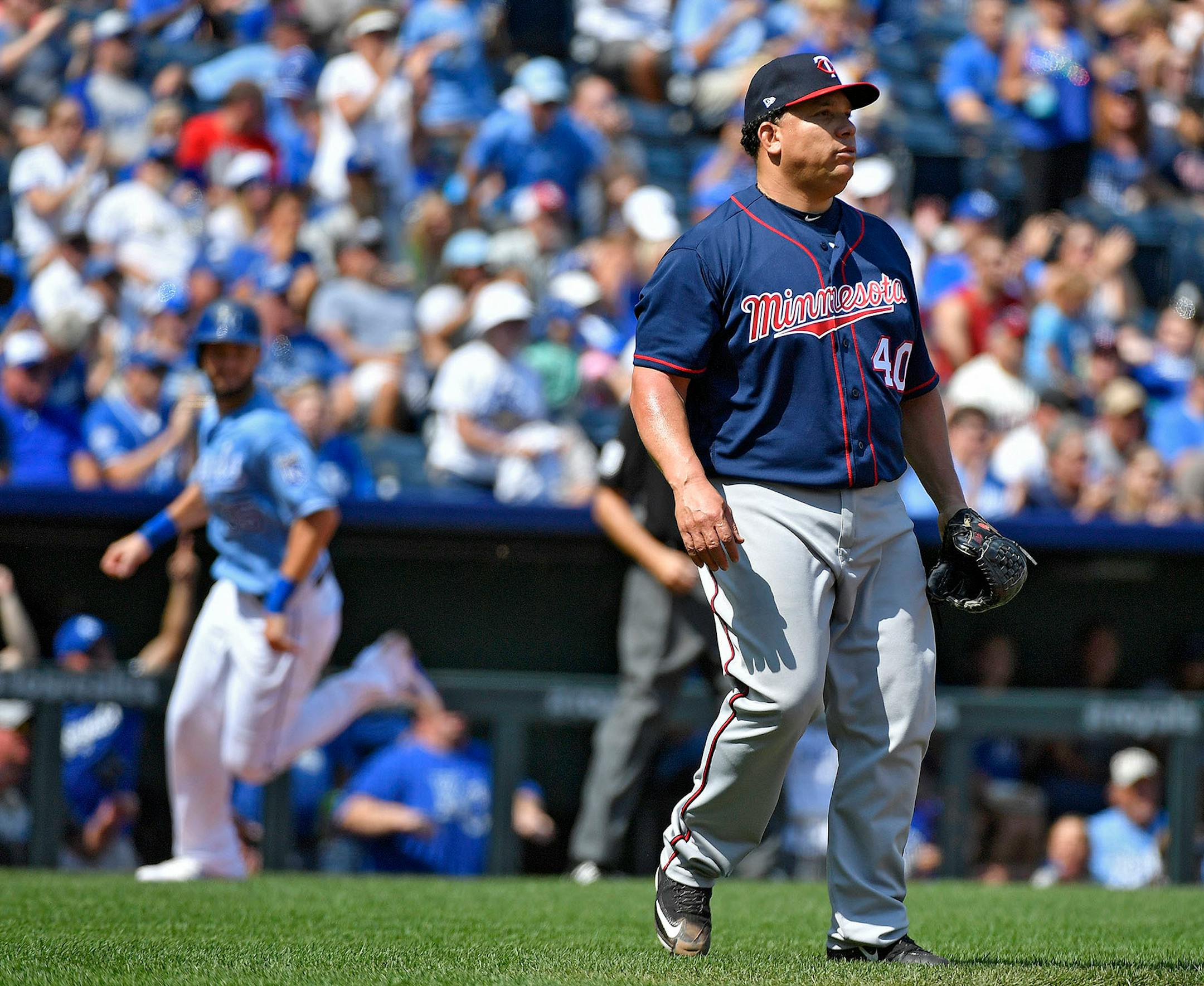 Minnesota Twins starting pitcher Bartolo Colon watches an RBI double by Kansas City Royals designated hitter Brandon Moss as Eric Hosmer scores in the second inning on Sunday, Sept. 10, 2017 at Kauffman Stadium in Kansas City, Mo.