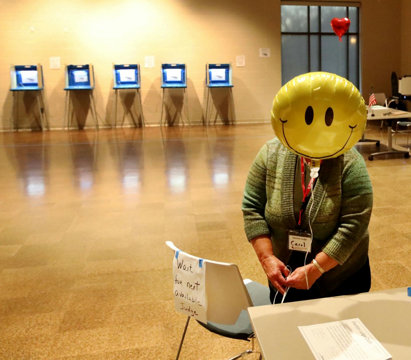 Election judge Carol Johnson tied a balloon to a chair before the polls opened at the Arlington Hills Community Center in St. Paul.