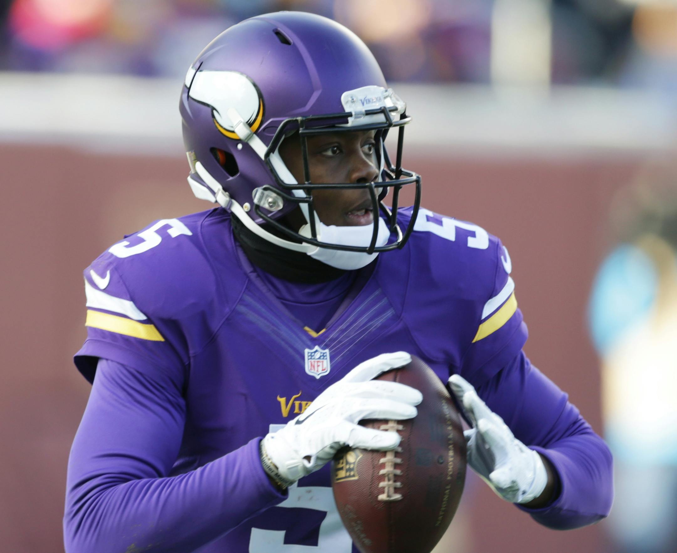 Minnesota Vikings quarterback Teddy Bridgewater looks to throw a pass during the second half of an NFL football game against the Carolina Panthers, Sunday, Nov. 30, 2014, in Minneapolis. (AP Photo/Jim Mone)