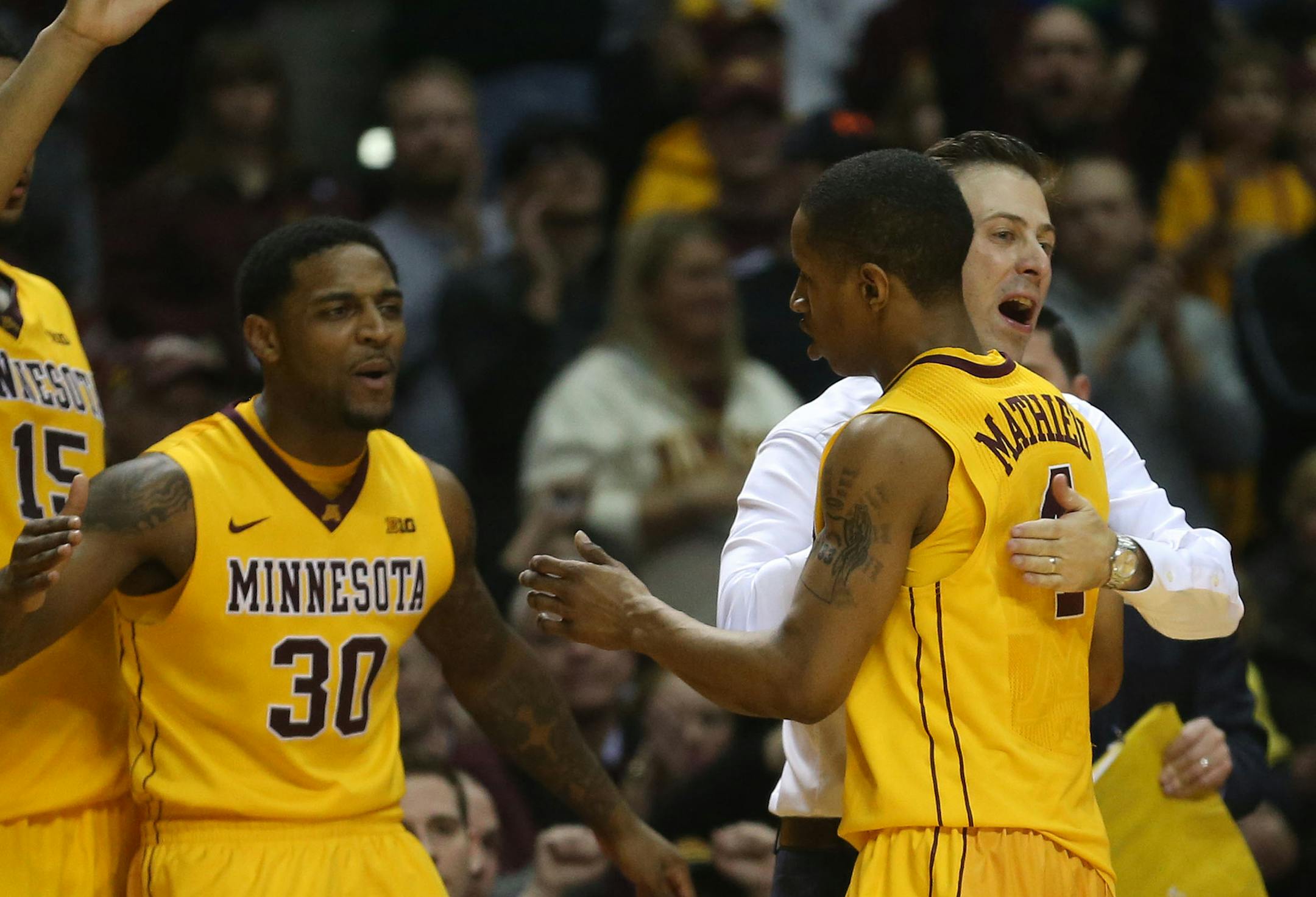 DeAndre Mathieu is hugged by head coach Richard Pitino during the second half at Williams Arena. The Gophers beat Indiana 66-60.