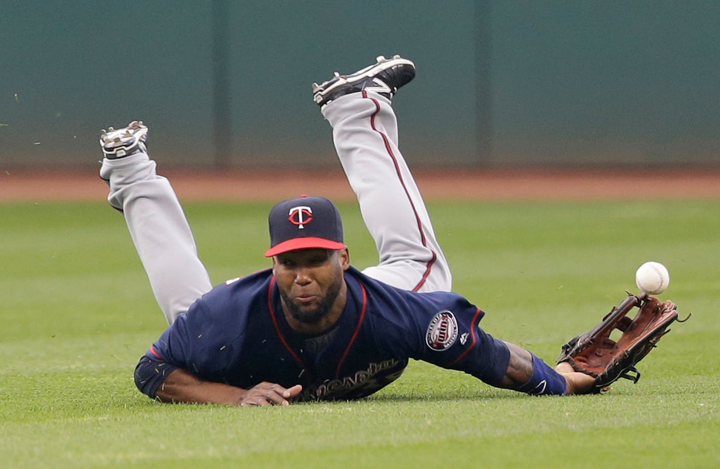 Minnesota Twins' Danny Santana can't get to a double hit by Cleveland Indians' Jose Ramirez during the second inning of a baseball game Friday, May 13, 2016, in Cleveland. (AP Photo/Tony Dejak)