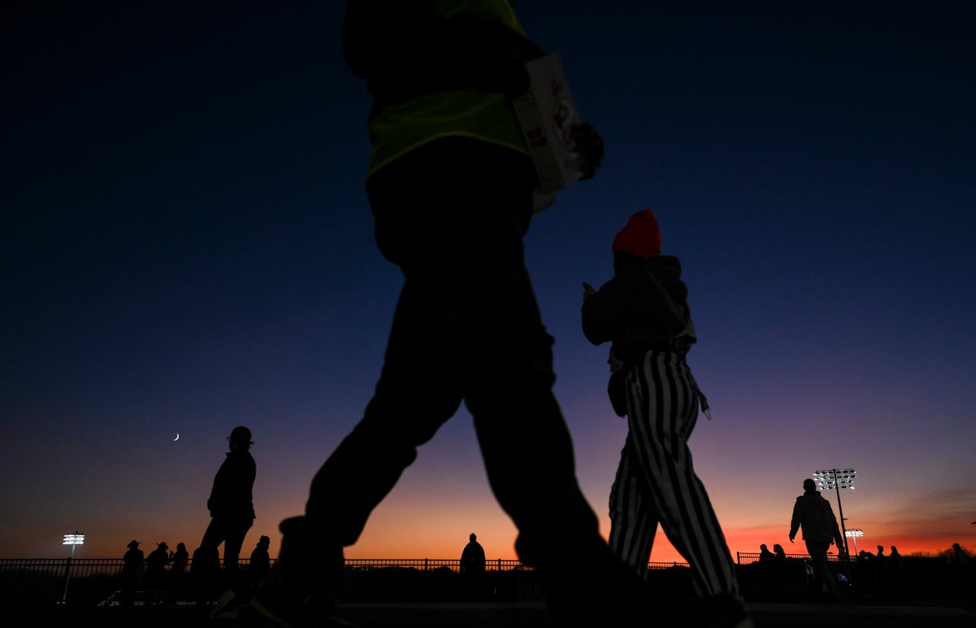 The sun sets before the start of a 6A football playoff game between Minnetonka and Lakeville North Friday, Oct. 28, 2022 at Minnetonka High School in Minnetonka, Minn.. ] AARON LAVINSKY • aaron.lavinsky@startribune.com