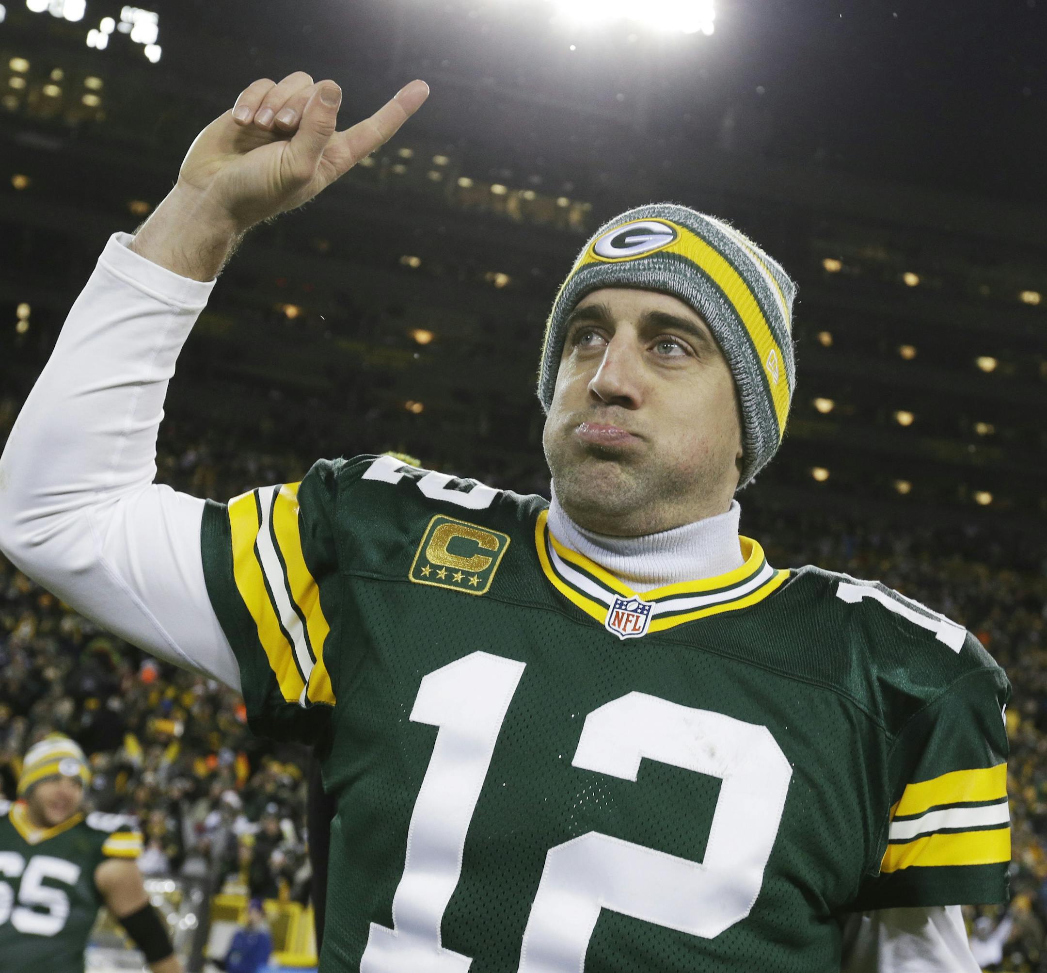Green Bay Packers' Aaron Rodgers celebrates after an NFL football game against the Detroit Lions Sunday, Dec. 28, 2014, in Green Bay, Wis. The Packers won 30-20. (AP Photo/Morry Gash)