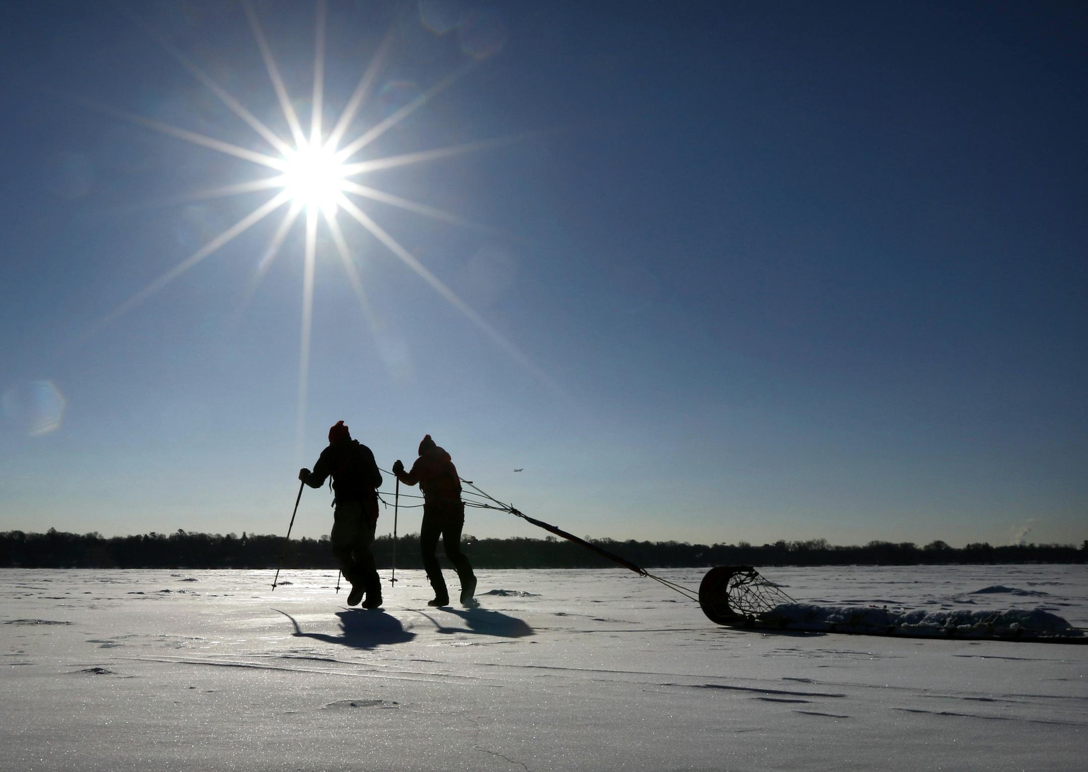 Will Steger, who will leave in coming weeks to canoe the boundary waters, east to west, as they break up with ice, has been training on Lake Harriet with training partner Molly Reichert. The two haul a sled with 150 pounds of sandbags to get in shape. ] BRIAN PETERSON ï brianp@startribune.com Minneapolis, MN - 2/26/2015