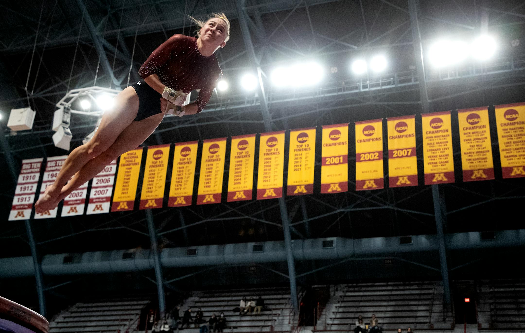 Lexy Ramler of Minnesota competes in the vault.