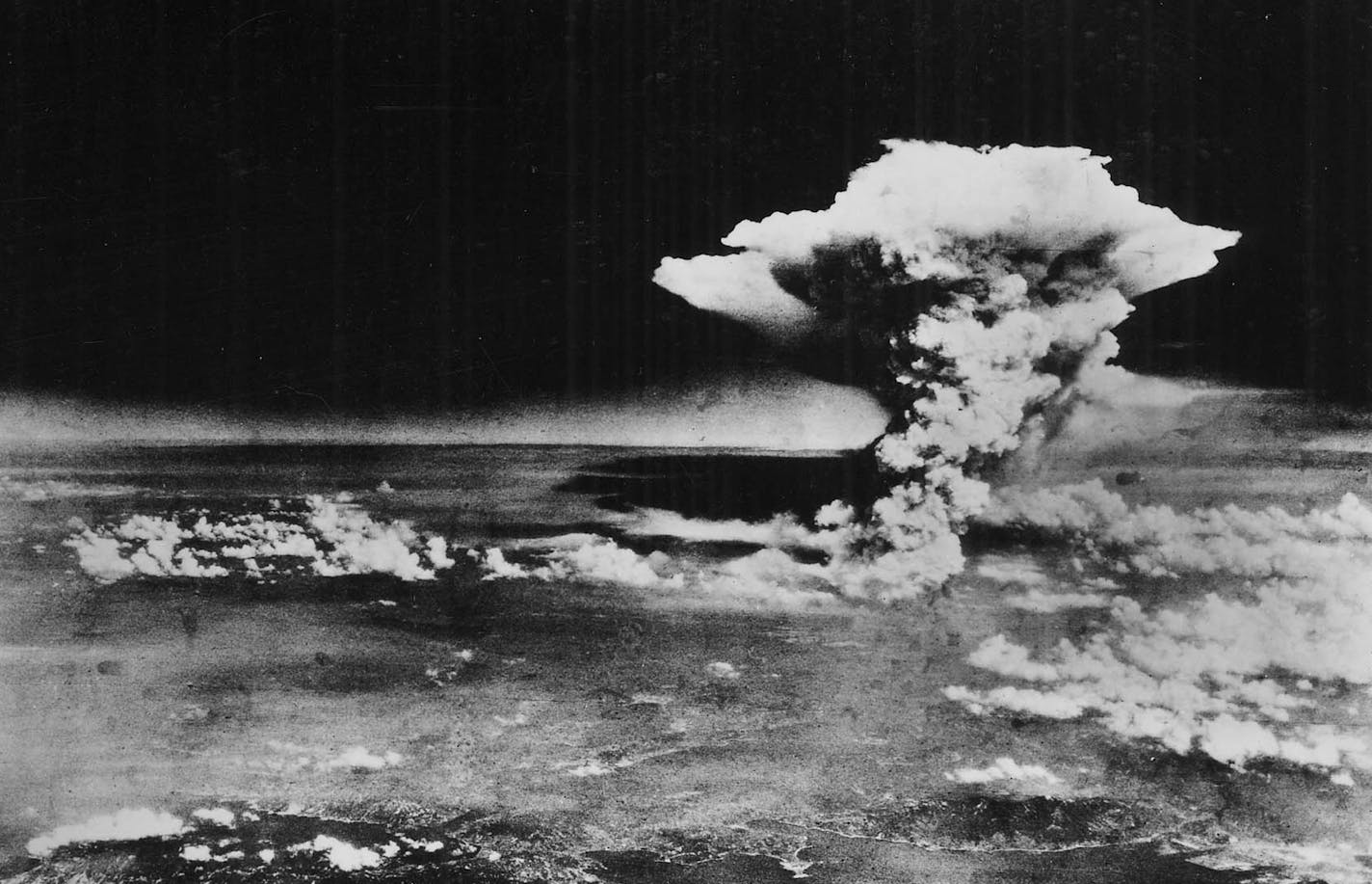 FILE - The mushroom cloud rises from Hiroshima, Japan, on Aug. 6, 1945, after the first atomic bomb was dropped by a B-29 bomber, as seen in this photo provided by the U.S. Army. President Obama will become the first sitting American president to visit Hiroshima making a heavily symbolic stop on May, 27, 2016, at the site where the United States first used an atomic bomb at the end of World War II. (U.S. Army via The New York Times) -- EDITORIAL USE ONLY -- ORG XMIT: MIN2016051313573854