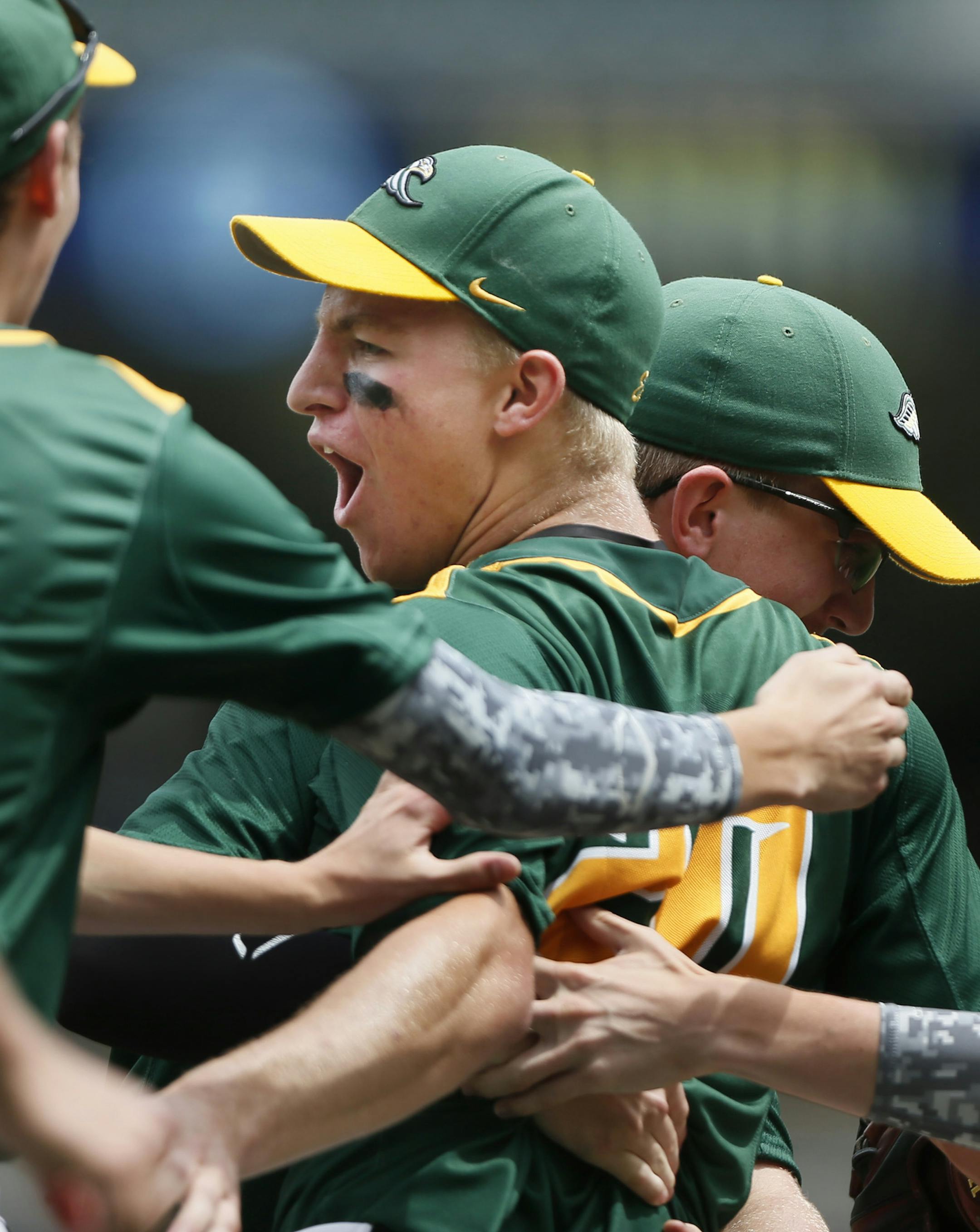 New Life Academy pitcher Sam Horner center celebrated with teammates during Class A high school baseball action between New York Mills and New Life Academy of Woodbury at Target Field Monday June 16, 2014 in Minneapolis ,MN. ] New Life beat New York Mills 5-4 to win the state championship. Jerry Holt Jerry.holt@startribune.com