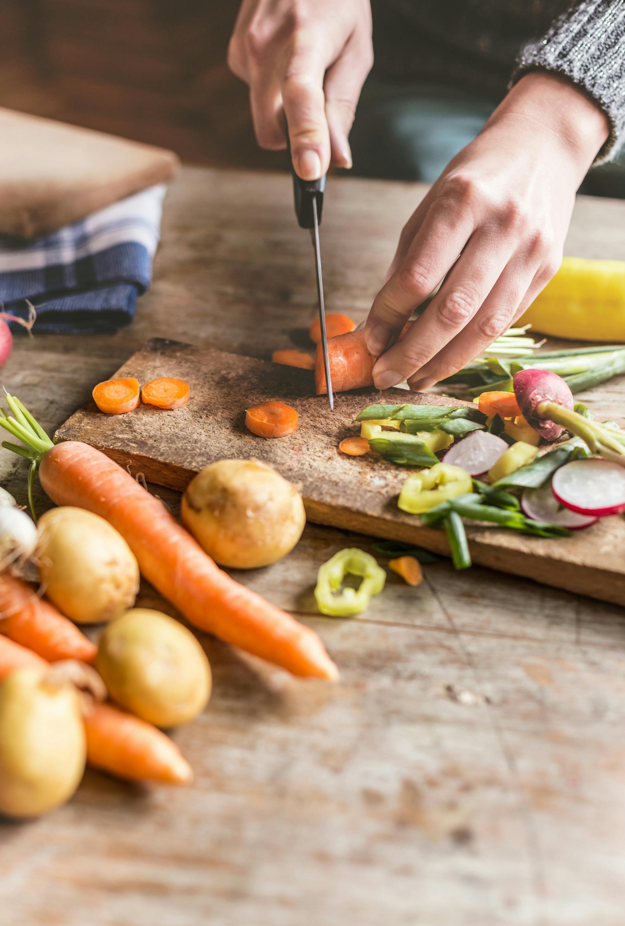 Woman Chopping food ingredients.
