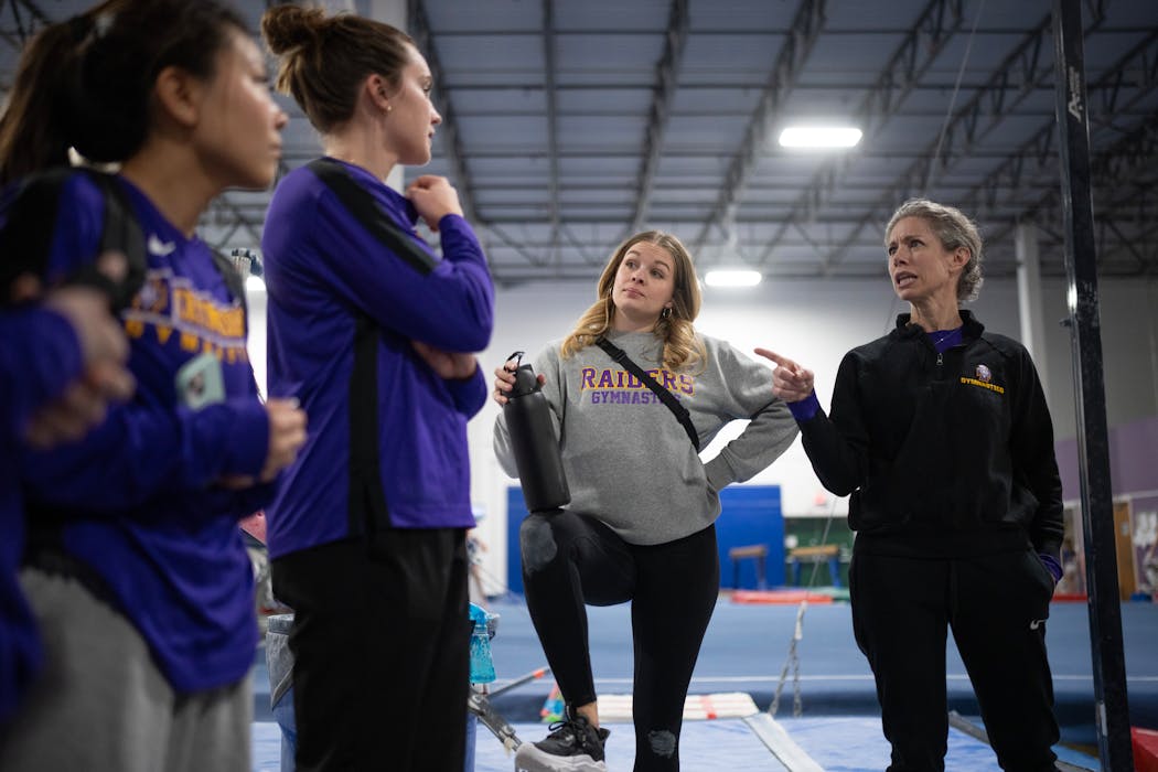 Athletes and coaches socialized as practice wound down. From left were gymnast Kana Try, assistant coach Anja Mundahl, head coach Claire Pritchard-Gutknecht and assistant coach Jonda Hughes.