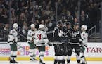 Los Angeles Kings right wing Marian Gaborik, center, celebrates his goal with right wing Dustin Brown, right, and defenseman Jake Muzzin during the th