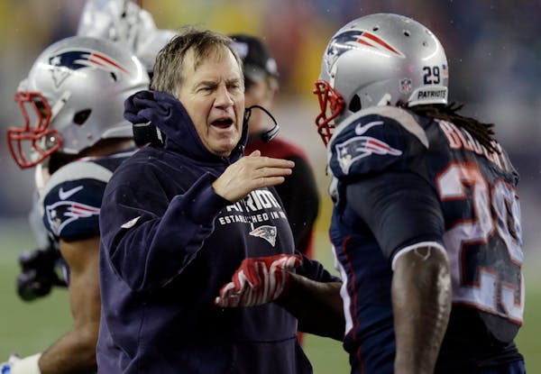 New England Patriots head coach Bill Belichick congratulates LeGarrette Blount after his touchdown during the second half of the NFL football AFC Cham