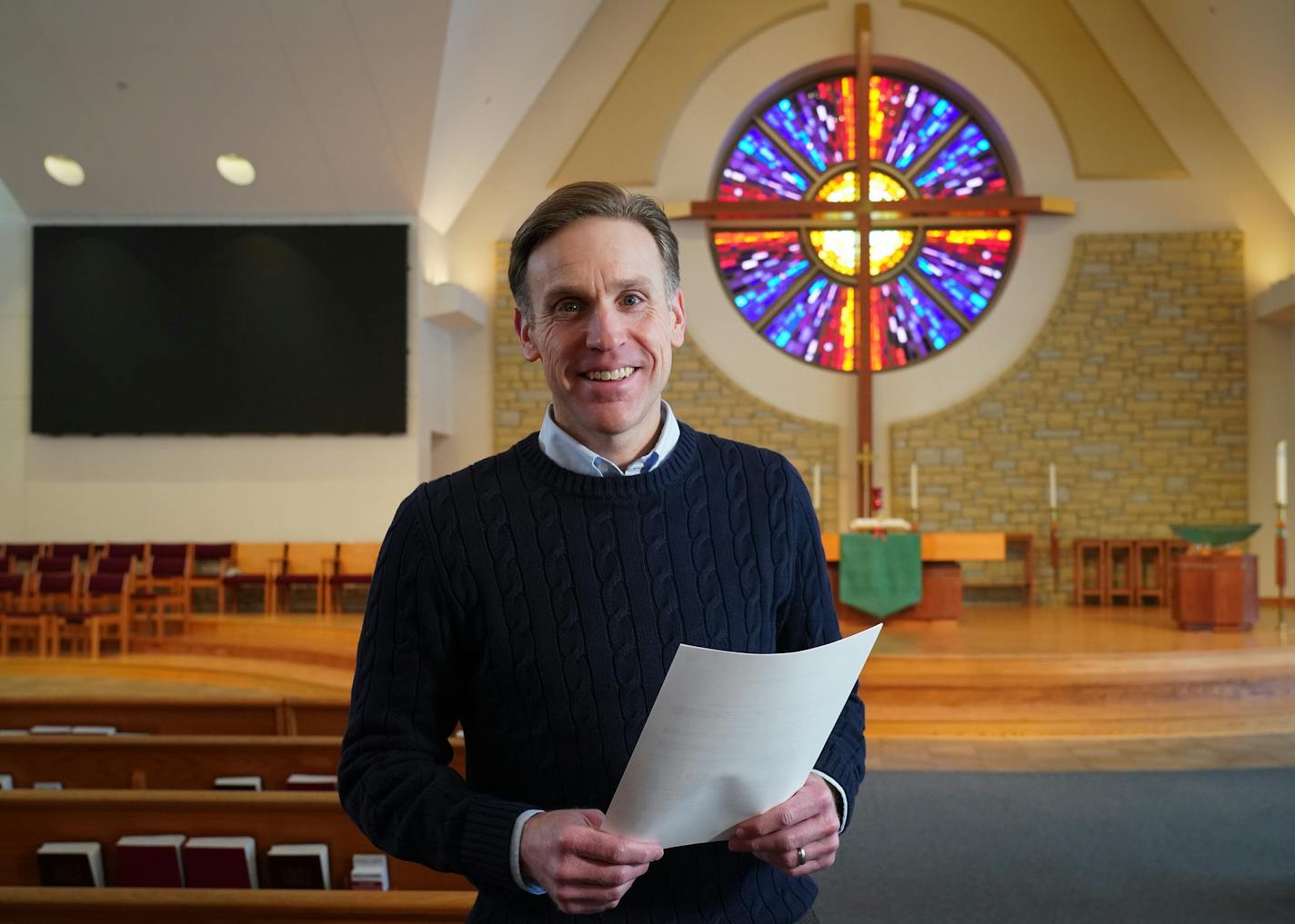 Pastor Joel Wight Hoogheem was photographed inside Lord of Life Lutheran Church in Maple Grove, Minn. as he held a copy of one of the letters of debt forgiveness that were sent out to more than 400 people. ] Shari L. Gross &#x2022; shari.gross@startribune.com The surprise letters arrived in the mailboxes of more than 400 low income residents of Texas and Arkansas, all in debt over medical bills. After a brief introduction, the letter states: "This debt has been cancelled and abolished by funds d