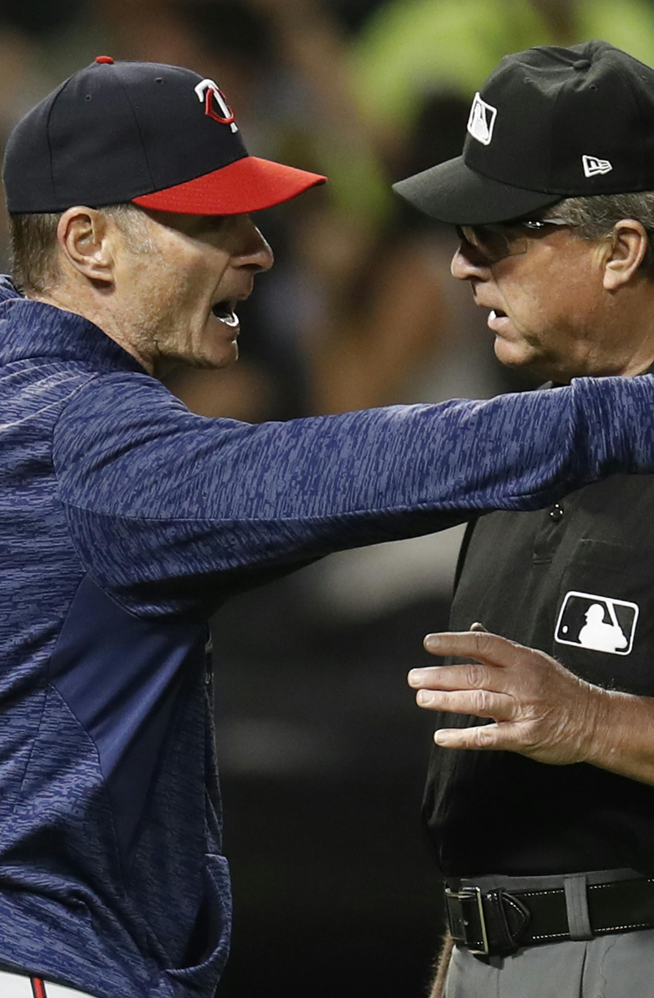 Minnesota Twins' manager Paul Molitor, left, argues with third base umpire Gerry Davis during the sixth inning of the team's baseball game against the Chicago White Sox on Wednesday, June 27, 2018, in Chicago. (AP Photo/Jim Young)